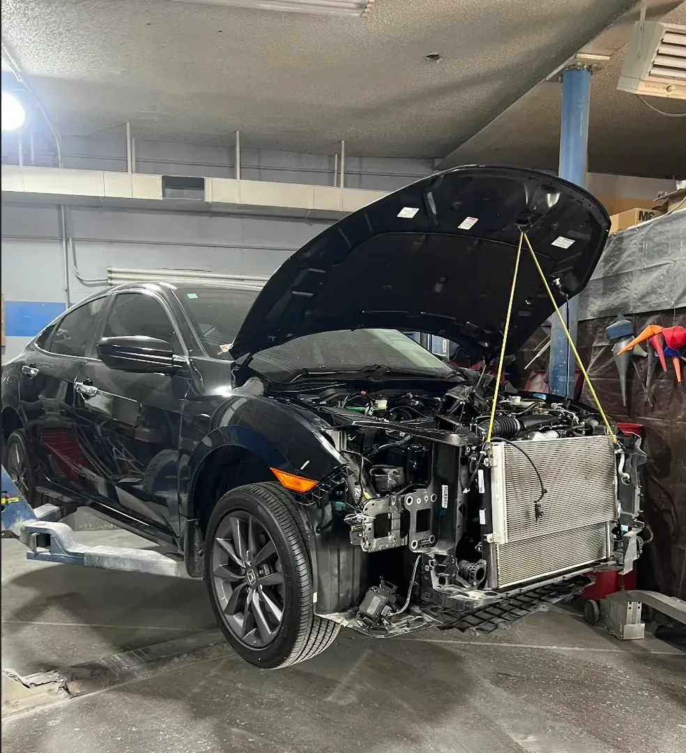 Black Honda before repair