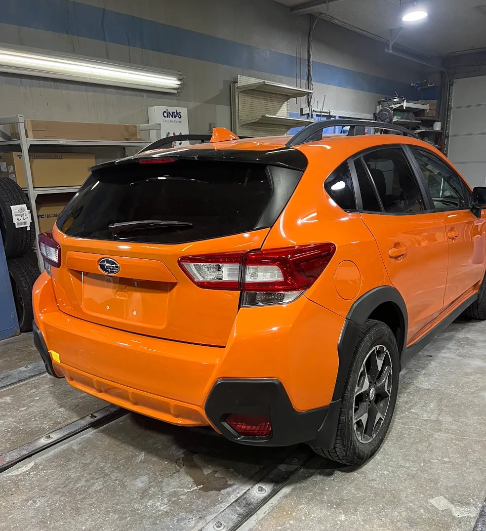 Orange Subaru after repair