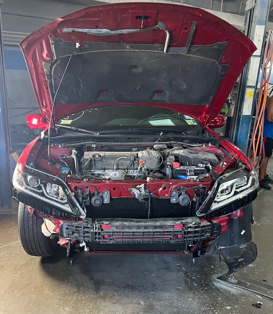 Red Honda before repair